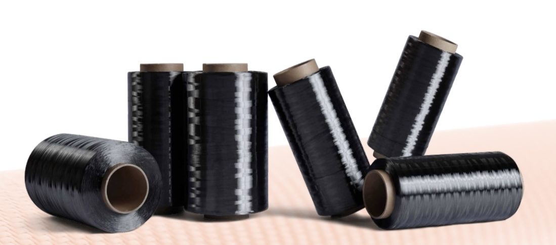 Rolls of black carbon fibre tow